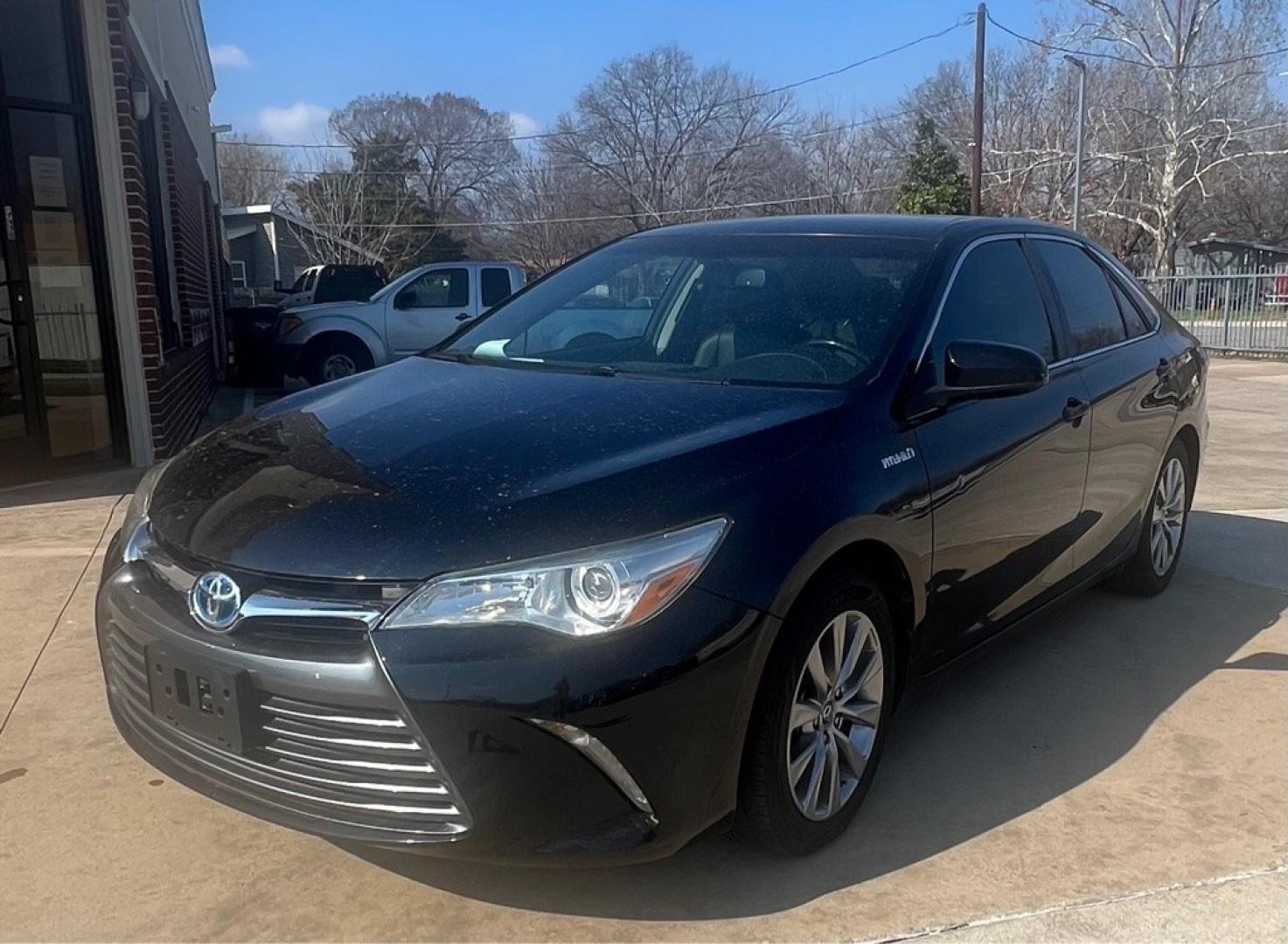 2015 BLACK TOYOTA CAMRY HYBRID (4T1BD1FK3FU) with an 2.5L engine, Continuously Variable transmission, located at 4415 NE 28th St, Haltom City, TX, 76117, (817) 222-9334, 32.795322, -97.280937- Photo#1