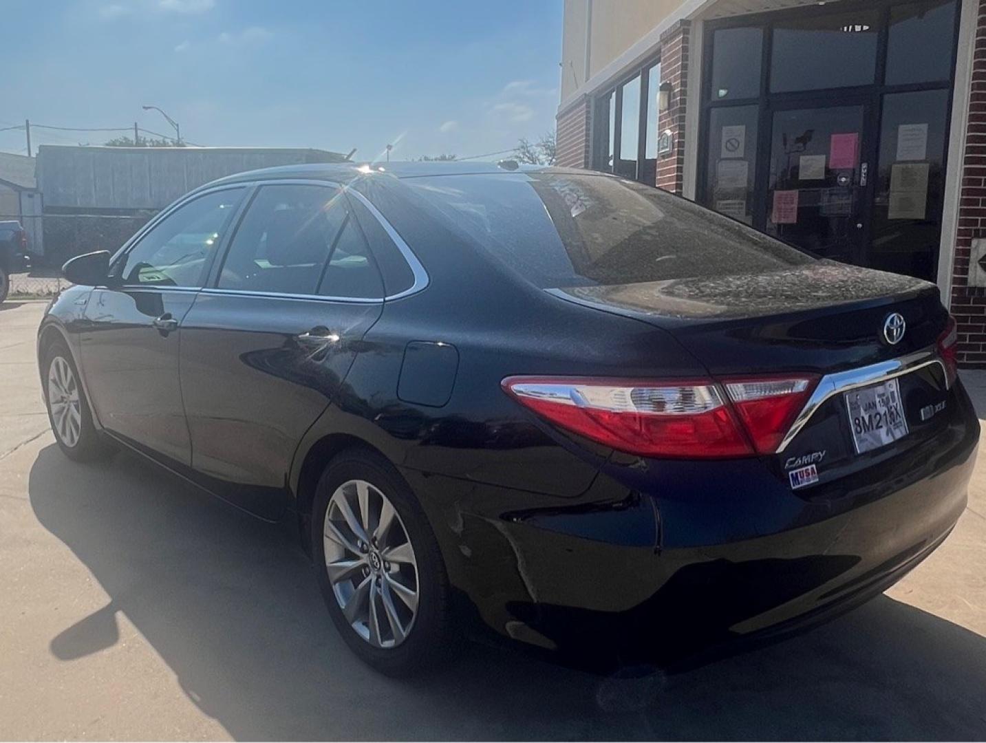 2015 BLACK TOYOTA CAMRY HYBRID (4T1BD1FK3FU) with an 2.5L engine, Continuously Variable transmission, located at 4415 NE 28th St, Haltom City, TX, 76117, (817) 222-9334, 32.795322, -97.280937- Photo#2